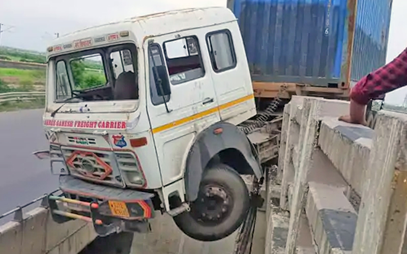 CONTAINER HANG ON BRIDGE